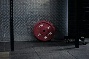 red round plastic lid on black textile